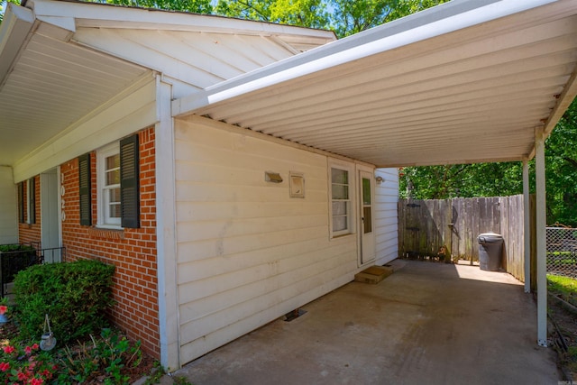 1020 Pine Valley Rd, Little Rock, AR 72207 - view of patio / terrace with a carport and fence