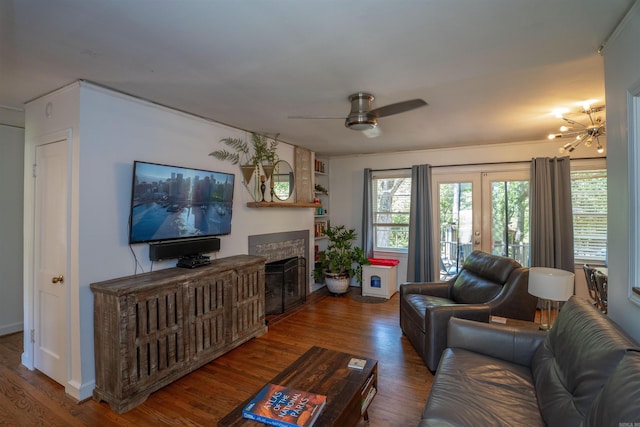 1020 Pine Valley Rd, Little Rock, AR 72207 - living room featuring ceiling fan with notable chandelier, french doors, wood finished floors, and a fireplace