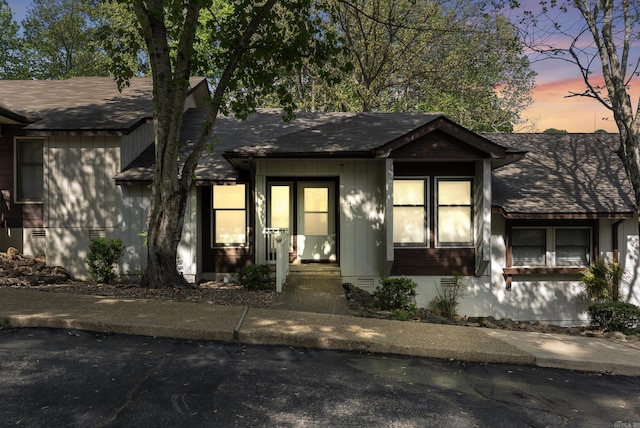 view of front of house featuring roof with shingles