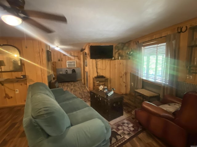 59 Easy St, Mount Ida, AR 71957 - living room with an AC wall unit, radiator heating unit, wood finished floors, ceiling fan, and wood walls