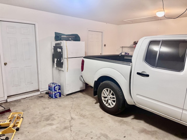 159 Emelia St, Clarksville, AR 72830 - garage with freestanding refrigerator