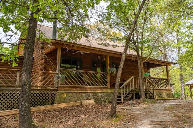 306 Schwinn Hill Rd, Hot Springs, AR 71909 - view of side of home with log exterior, metal roof, and covered porch