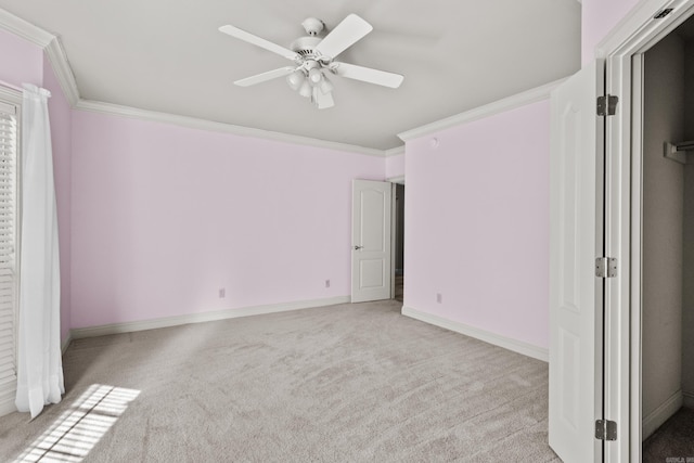 unfurnished bedroom with ceiling fan, light carpet, ornamental molding, and baseboards