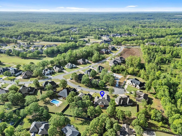 birds eye view of property with a residential view and a view of trees