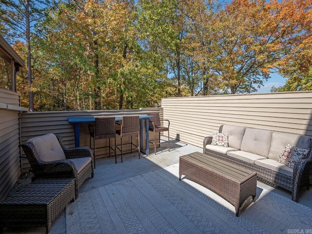 view of patio / terrace with outdoor dry bar, outdoor lounge area, and a fenced backyard