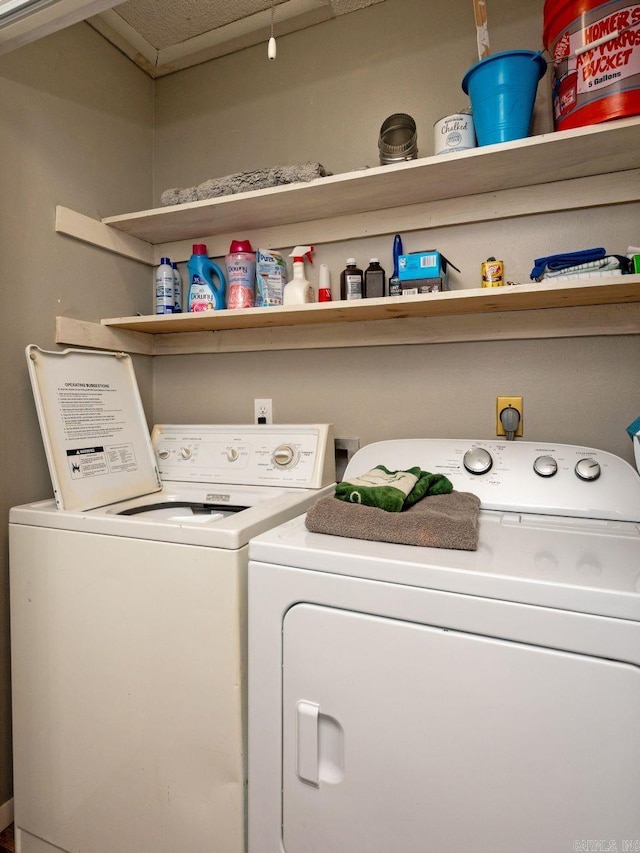 laundry room featuring washing machine and dryer and laundry area