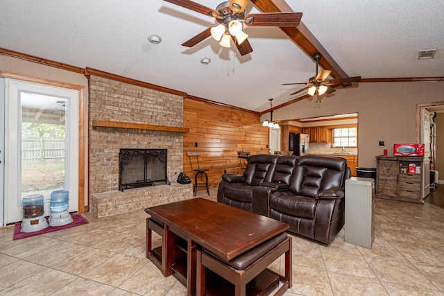 1 Azalea, Magnolia, AR 71753 - living room with wood walls, light tile patterned floors, crown molding, a textured ceiling, and ceiling fan