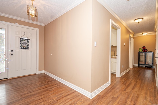 1 Azalea, Magnolia, AR 71753 - entryway featuring baseboards, ornamental molding, wood finished floors, and a textured ceiling
