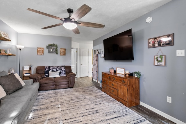 108 Rambler Ln, Rose Bud, AR 72137 - living area featuring baseboards, a ceiling fan, wood finished floors, and a textured ceiling
