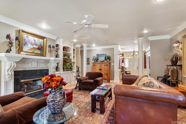 living area featuring a tiled fireplace, built in features, recessed lighting, a ceiling fan, and ornamental molding