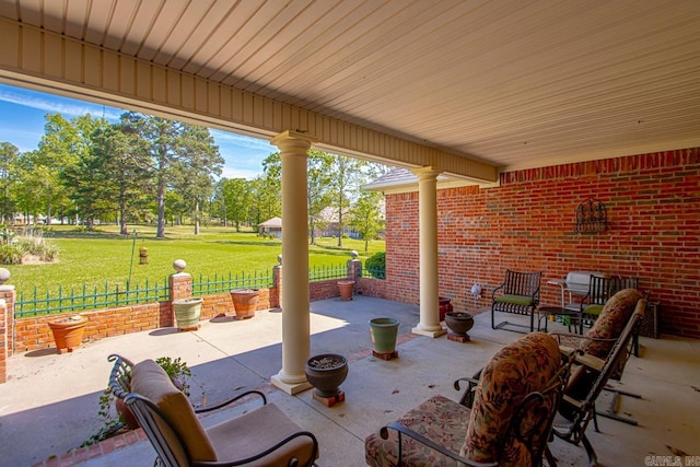 view of patio featuring fence