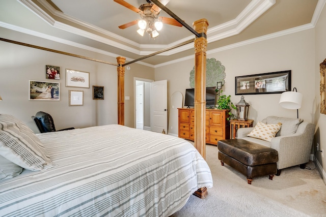 bedroom featuring a raised ceiling, ornamental molding, baseboards, and light carpet
