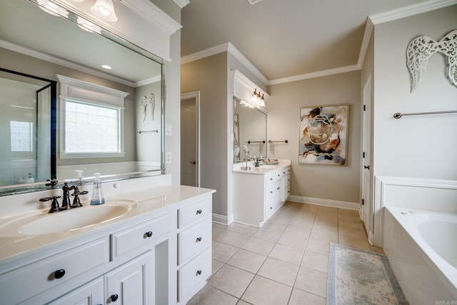 full bath featuring tile patterned floors, ornamental molding, a sink, two vanities, and a garden tub