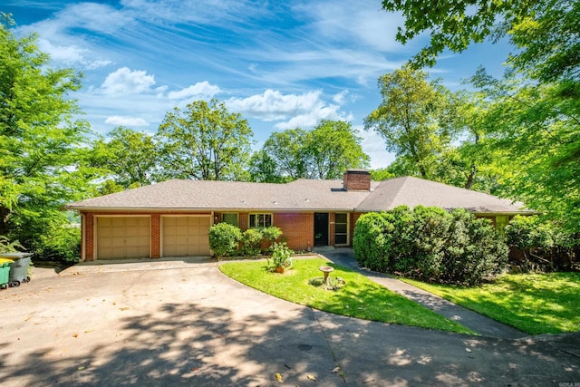 ranch-style house with a front lawn, a garage, brick siding, a chimney, and concrete driveway