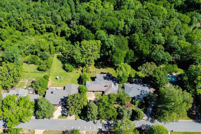 birds eye view of property with a residential view and a wooded view