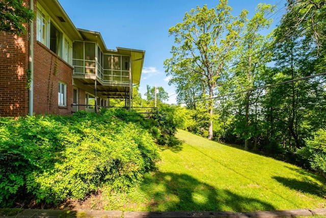 view of yard featuring a sunroom