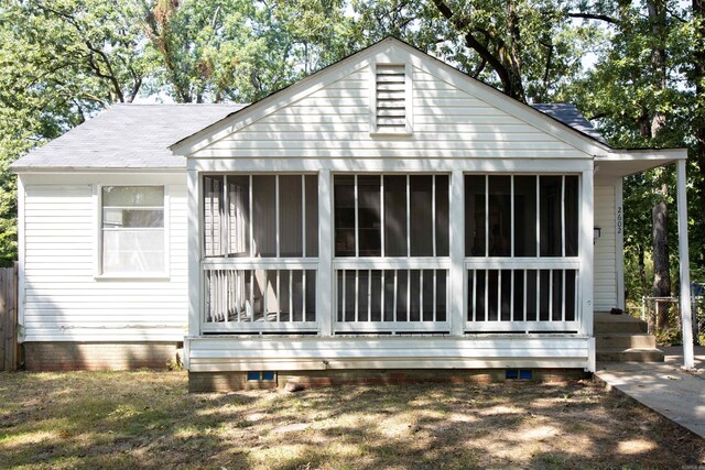 2602 S Taylor St, Little Rock, AR 72204 - view of property exterior with crawl space, a sunroom, and roof with shingles