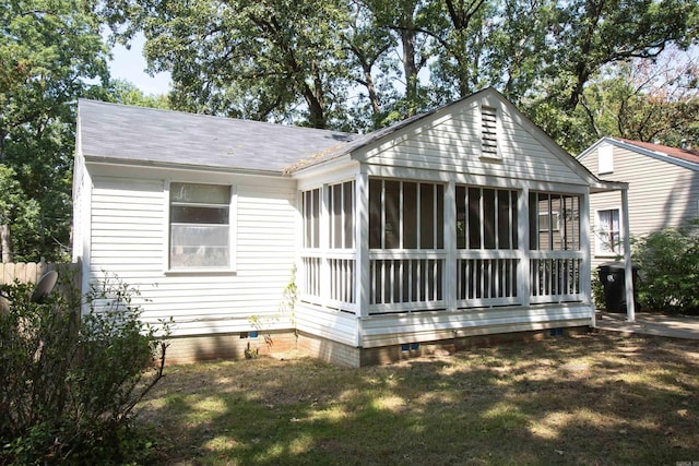 2602 S Taylor St, Little Rock, AR 72204 - back of house featuring a shingled roof, a sunroom, crawl space, and a lawn