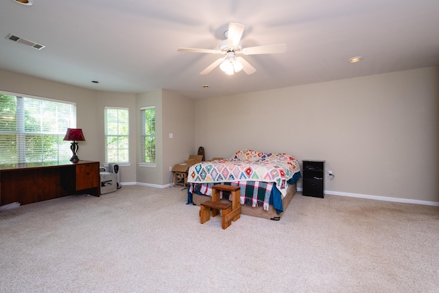 bedroom featuring baseboards, a ceiling fan, carpet flooring, and visible vents