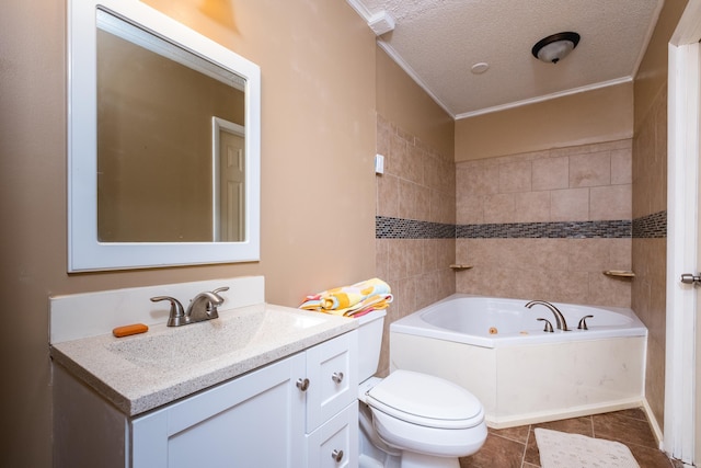 bathroom with tile patterned flooring, a tub with jets, ornamental molding, vanity, and a textured ceiling