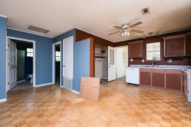 kitchen featuring a sink, dishwasher, ceiling fan, light countertops, and baseboards