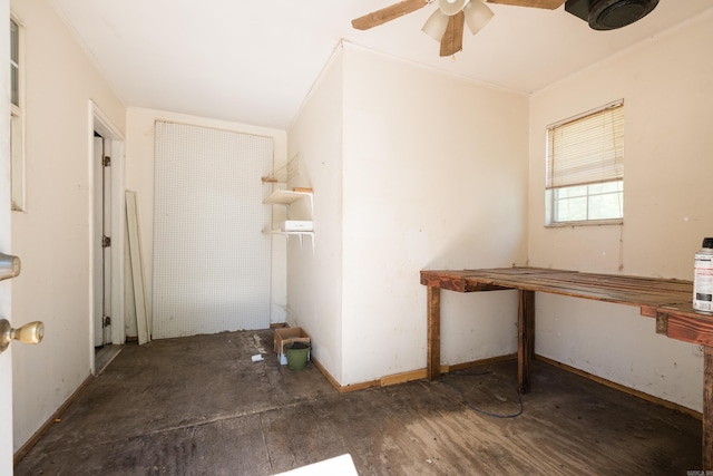 interior space with wood finished floors and ceiling fan