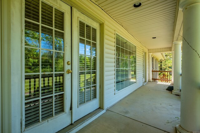 view of patio / terrace with french doors and covered porch