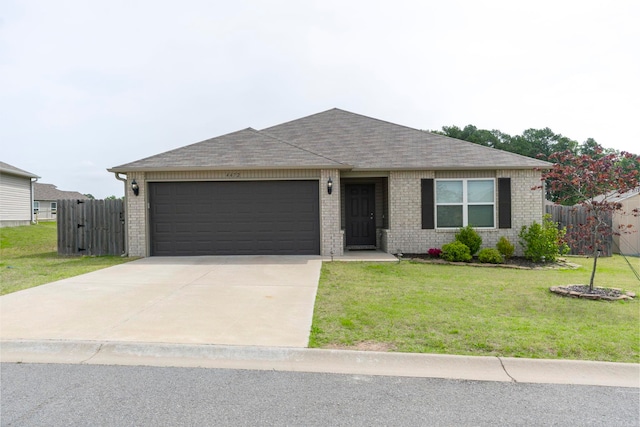 4472 Olympic, Benton, AR 72019 - ranch-style house with a shingled roof, driveway, brick siding, a front yard, and a garage