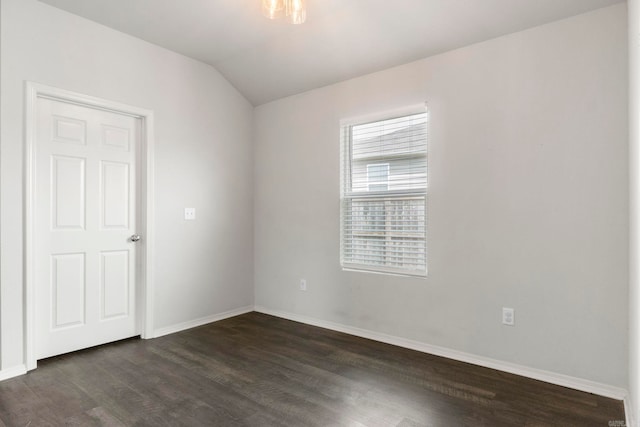 4472 Olympic, Benton, AR 72019 - spare room featuring dark wood-type flooring, vaulted ceiling, and baseboards