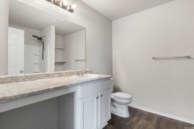 4472 Olympic, Benton, AR 72019 - full bath with wood finished floors, vanity, walk in shower, baseboards, and toilet