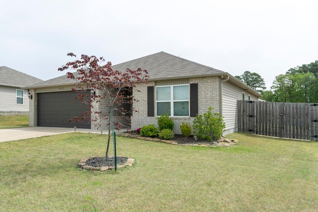 4472 Olympic, Benton, AR 72019 - view of front facade featuring fence, a front lawn, concrete driveway, an attached garage, and brick siding