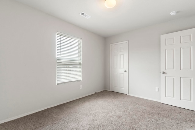 4472 Olympic, Benton, AR 72019 - unfurnished bedroom featuring baseboards, visible vents, and carpet
