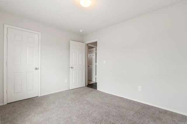 4472 Olympic, Benton, AR 72019 - unfurnished bedroom featuring carpet flooring and baseboards