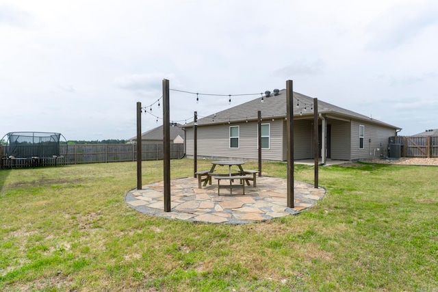 4472 Olympic, Benton, AR 72019 - view of yard with a patio area, a fenced backyard, and a trampoline