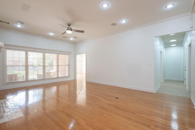 131 Hidden Valley Loop, Maumelle, AR 72113 - unfurnished living room featuring ceiling fan, crown molding, visible vents, and light wood-style flooring