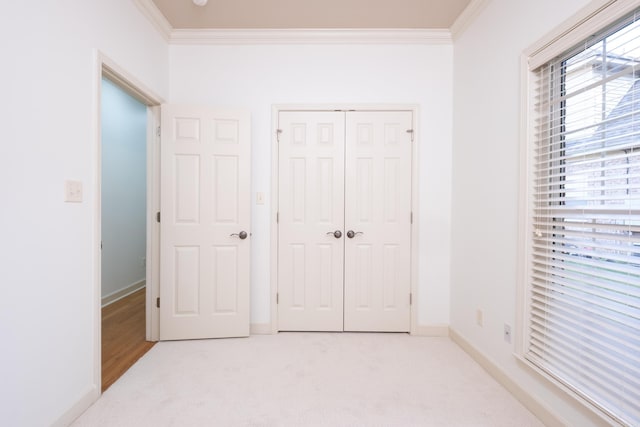 131 Hidden Valley Loop, Maumelle, AR 72113 - unfurnished bedroom featuring baseboards, light carpet, crown molding, and a closet
