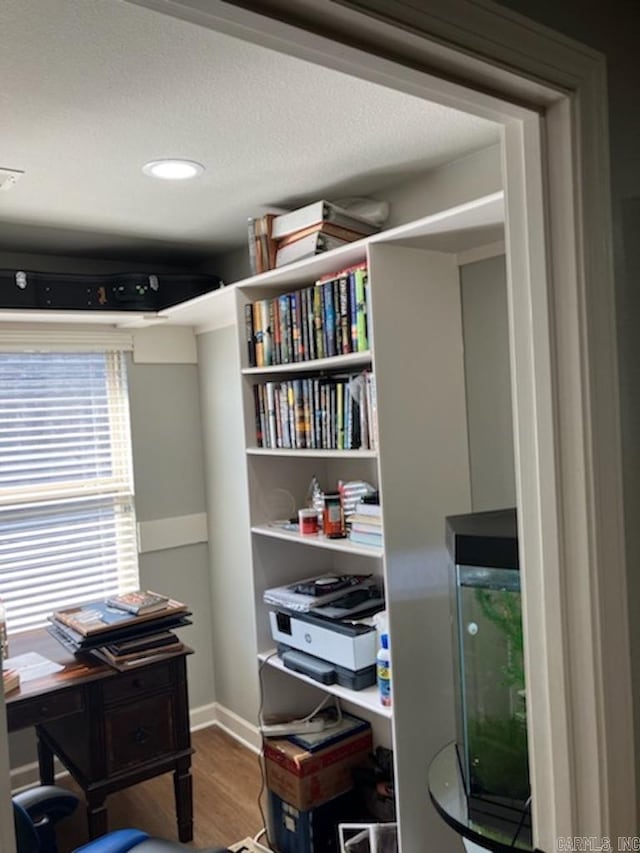 office with baseboards, wood finished floors, and recessed lighting
