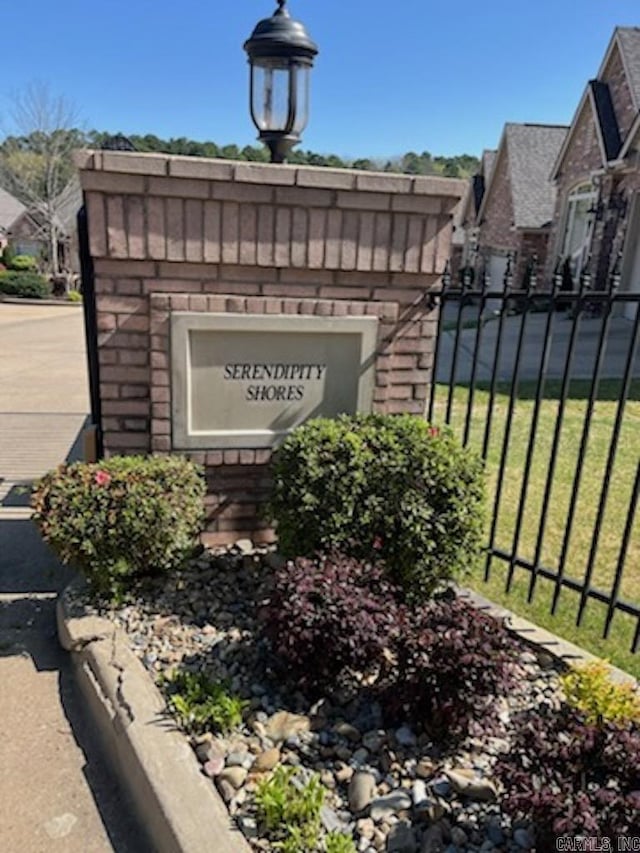 community sign with fence