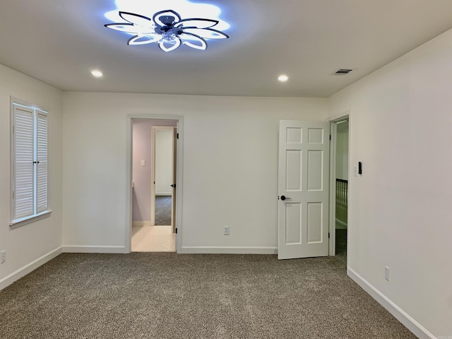 unfurnished bedroom with recessed lighting, baseboards, and carpet