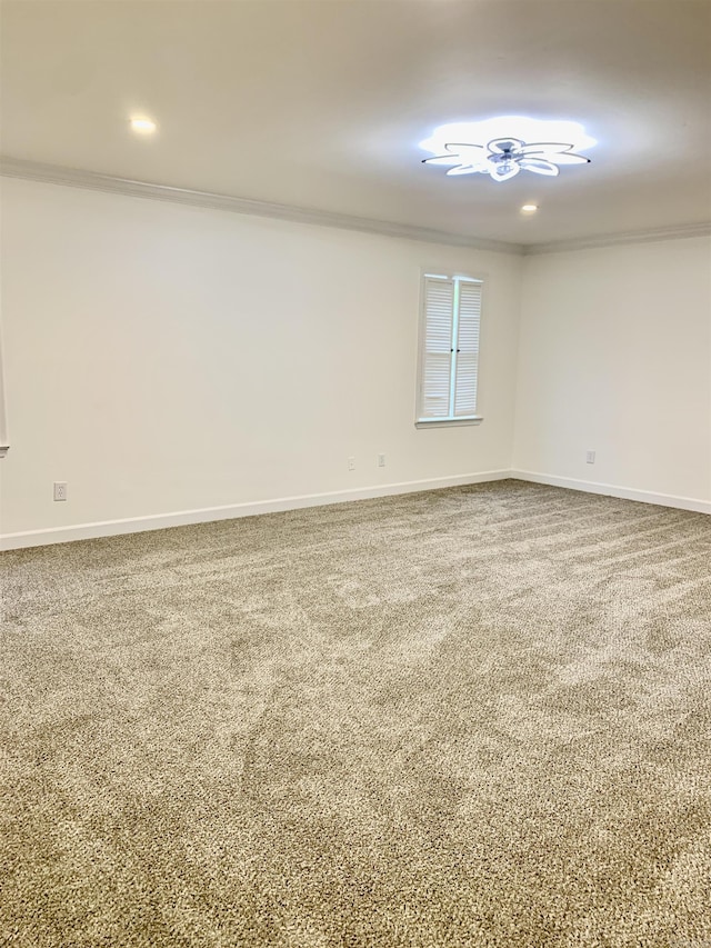 carpeted spare room featuring baseboards, ornamental molding, and recessed lighting