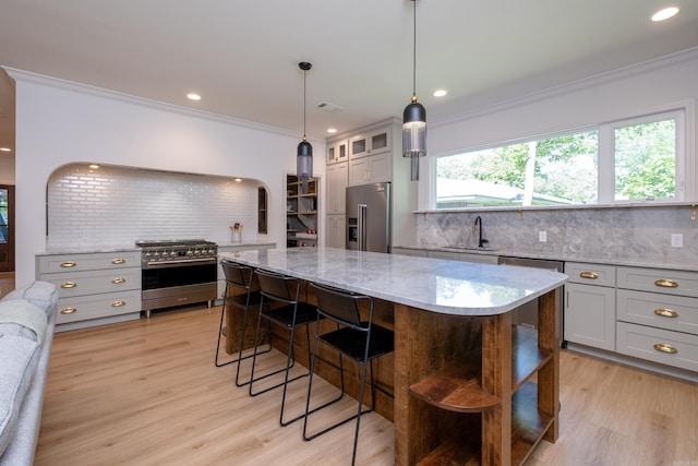 6600 Waverly Dr, Little Rock, AR 72207 - kitchen with high end appliances, gray cabinets, and decorative backsplash