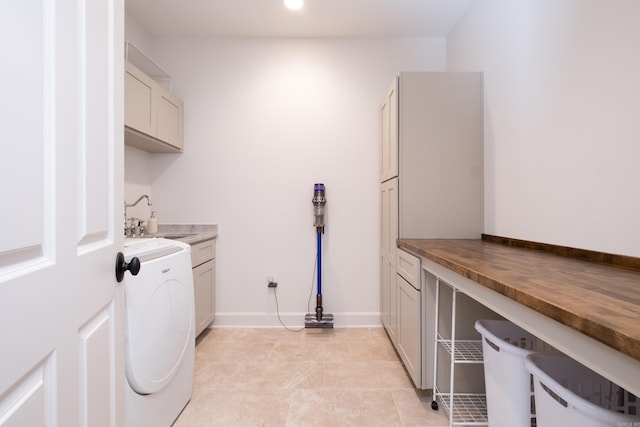 6600 Waverly Dr, Little Rock, AR 72207 - washroom featuring washer / dryer, cabinet space, a sink, and baseboards