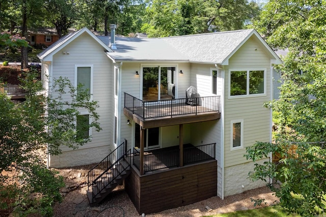 6600 Waverly Dr, Little Rock, AR 72207 - back of house featuring stairway, a shingled roof, and a balcony