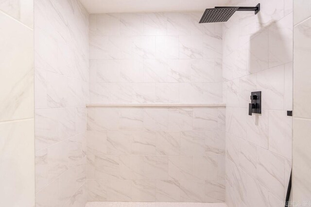 full bathroom with tiled shower