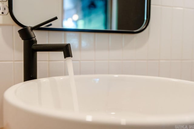 details featuring a freestanding tub and a sink