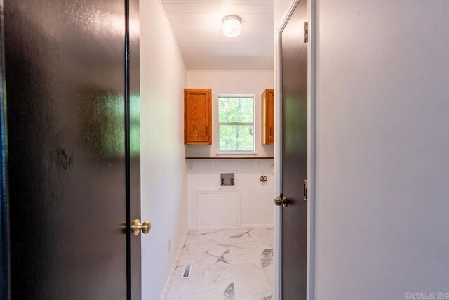 washroom featuring marble finish floor, baseboards, cabinet space, and hookup for a washing machine