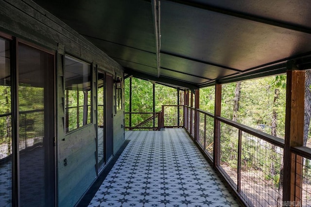 unfurnished sunroom featuring a wealth of natural light