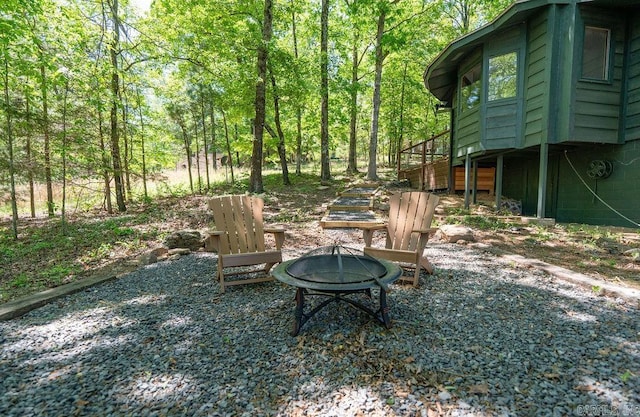 view of yard featuring a fire pit and stairway