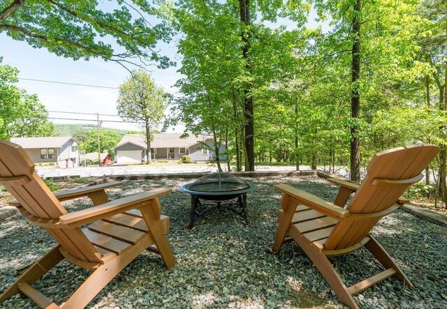exterior space featuring an outdoor fire pit