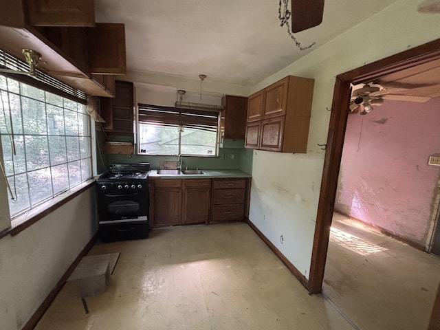 3000 Cobb St, Little Rock, AR 72204 - kitchen featuring plenty of natural light, black range with gas stovetop, baseboards, and a sink